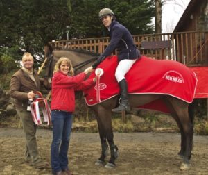 From left, Charles Hanley of Claremorris Equitation Centre and Nia O'Malley representing sponsor Connolly's RED MILLS with Liam O’Meara and Mr Coolcaum, winners of the Claremorris Auctions sponsored seventh round of the HSI/Connolly’s RED MILLS Spring Tour at Claremorris Equestrian Centre. Photo: Monica Flanagan