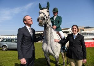 Edward Butler, on CSF Whiterock Cruise, with Simon Coveney TD, Minister for Agriculture, Food, the Marine and Defence, and Elizabeth Mair, Special Olympics Ireland Athlete, at the launch of 'Jumping In The City' which will take place in greyhound stadia in Limerick, Cork and Dublin on Friday nights during the month of June.