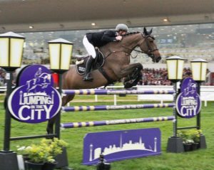 Co Kildare's Alexander Butler riding the Ladycastle Syndicate owned Vimminka pictured winning tonight's The Underwriting Exchange Limited Grand Prix at Jumping In The City, Cork