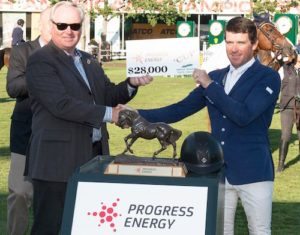 Michael Culbert, President & CEO, Progress Energy presents Conor Swail with his winning prize of $28,000.