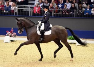 Judy Reynolds and Vancouver K competing in the Reem Acra FEI World Cup Dressage Grand Prix, London International Horse Show, Olympia 