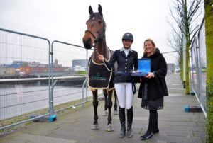 Elaine Hatton (International Marketing Director, Horse Sport Ireland) congratulates Aisling Byrne & Wellview Classic Dream - winners of the Irish Horse Gateway Am. GP at the Equestrian.com Liverpool International Horse Show