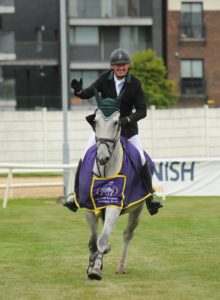 5 August 2016; Paul Carroll on Castleroche La Roche salutes the crowd during his victory lap winning the Westwood/Ifor Williams Amateur Speed during the Underwriting Exchange Jumping In the City 2016 at Shelbourne Park Greyhound Stadium in Dublin. Photo by Sam Barnes/Sportsfile *** NO REPRODUCTION FEE ***