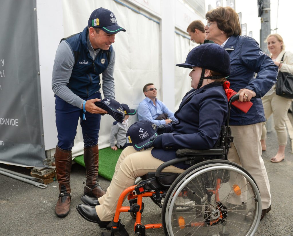 Cian O'Connor with Lynn Frain, from Mullingar, Co Westmeath, as Members of the Irish  Aga Khan squad support the Riding for the Disabled Association Ireland. Pic: Sportsfile